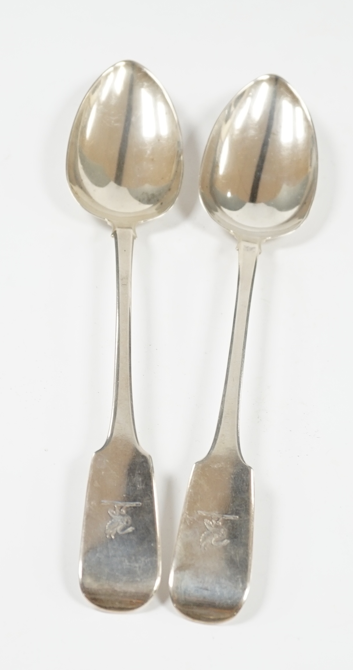 A pair of George IV Irish silver fiddle pattern basting spoons, James Brady, Dublin, 1828, 30.4cm, 7.6oz. Condition - fair